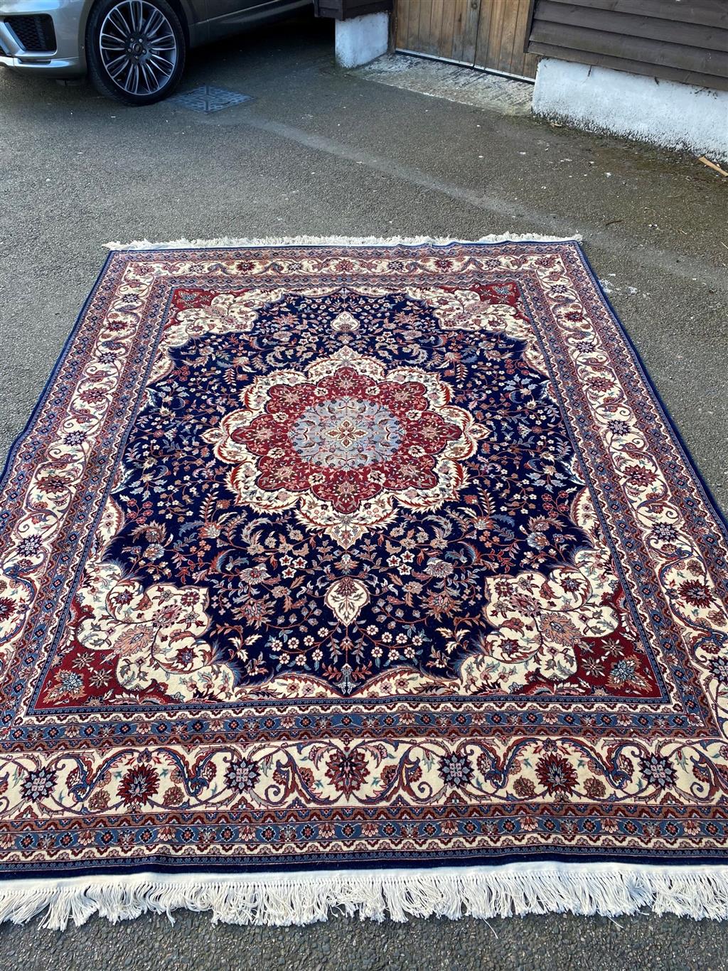 A Duruder blue ground carpet, 306 x 242cm